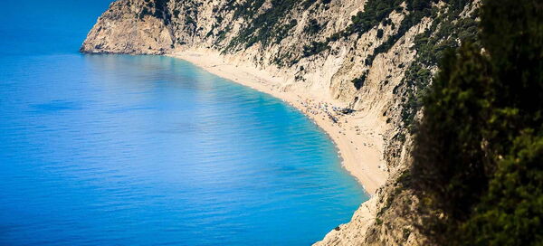 Egremni beach with beautiful silky white sand and crystal clear Caribbean blue water