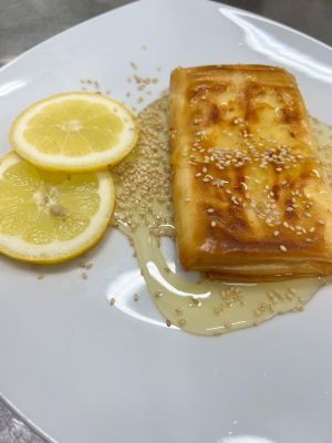 Feta cheese wrapped in phyllo pastry with honey and sesame seeds